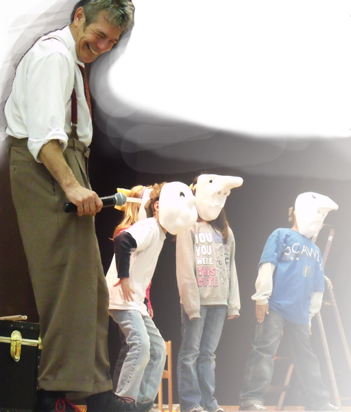 School assemblies - kids acting with masks on, Jacob smiling