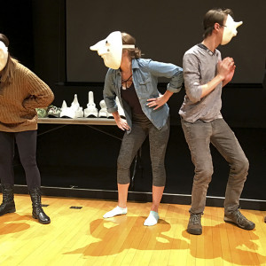 Group class performance - gesturing with masks Group class performance - gesturing with masks